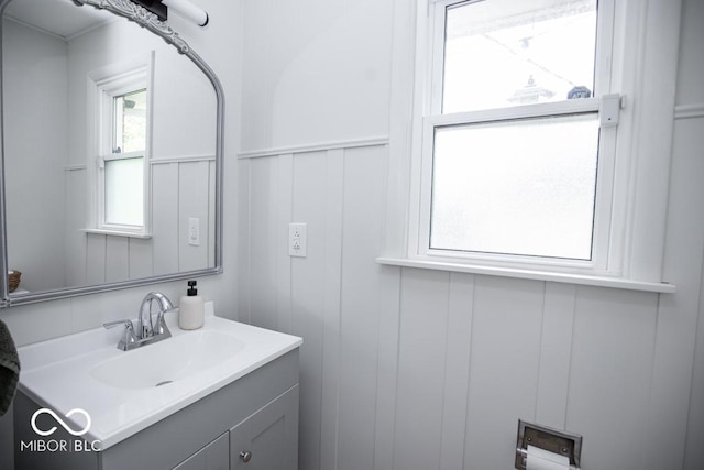8310 N County Road 700 W, Scipio, IN 47273 - bathroom featuring vanity, a decorative wall, and a wainscoted wall
