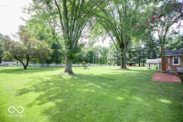 8310 N County Road 700 W, Scipio, IN 47273 - view of yard with a playground and view of wooded area