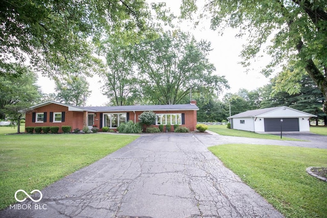 8310 N County Road 700 W, Scipio, IN 47273 - ranch-style house featuring a garage, an outdoor structure, a chimney, brick siding, and a front lawn