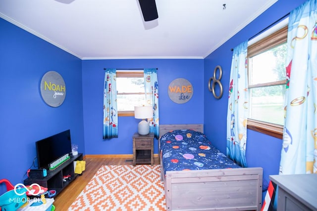 8310 N County Road 700 W, Scipio, IN 47273 - bedroom featuring wood finished floors, crown molding, and a ceiling fan
