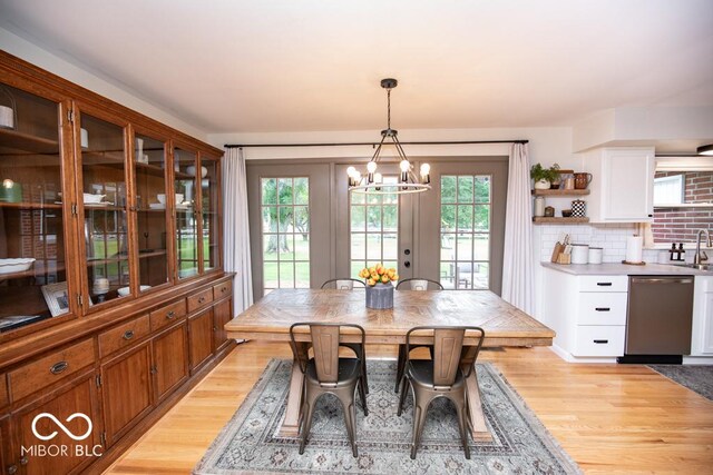 8310 N County Road 700 W, Scipio, IN 47273 - dining room with light wood-style floors, a chandelier, and healthy amount of natural light