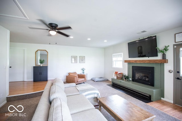 8310 N County Road 700 W, Scipio, IN 47273 - carpeted living room with a ceiling fan, a fireplace, and recessed lighting
