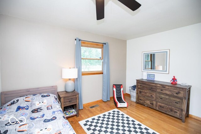 8310 N County Road 700 W, Scipio, IN 47273 - bedroom featuring light wood-style flooring and a ceiling fan