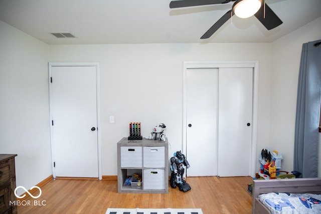 8310 N County Road 700 W, Scipio, IN 47273 - bedroom with light wood-style floors, ceiling fan, and a closet