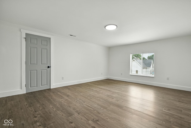 2000 N Dexter St, Indianapolis, IN 46202 - empty room featuring dark wood-type flooring and baseboards