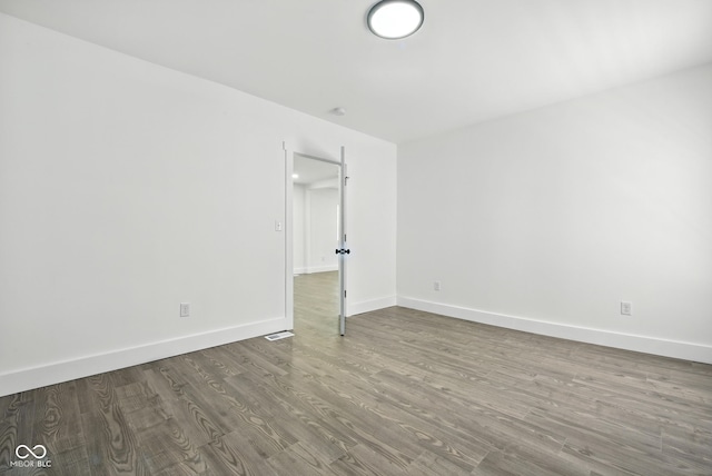 2000 N Dexter St, Indianapolis, IN 46202 - spare room with wood finished floors and baseboards