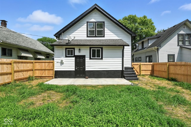 2000 N Dexter St, Indianapolis, IN 46202 - rear view of house featuring a fenced backyard, a shingled roof, and a patio area