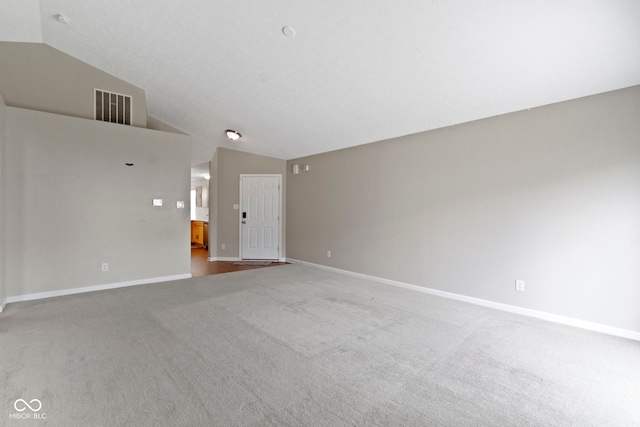 11426 High Grass Dr, Indianapolis, IN 46235 - carpeted empty room featuring vaulted ceiling