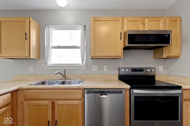 11426 High Grass Dr, Indianapolis, IN 46235 - kitchen with appliances with stainless steel finishes, light brown cabinets, and light countertops