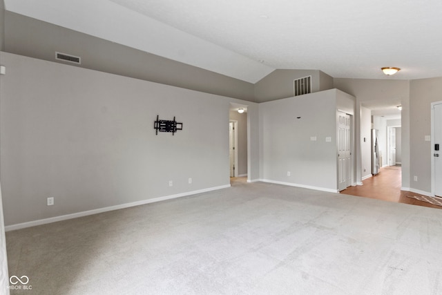 11426 High Grass Dr, Indianapolis, IN 46235 - carpeted spare room featuring baseboards and lofted ceiling