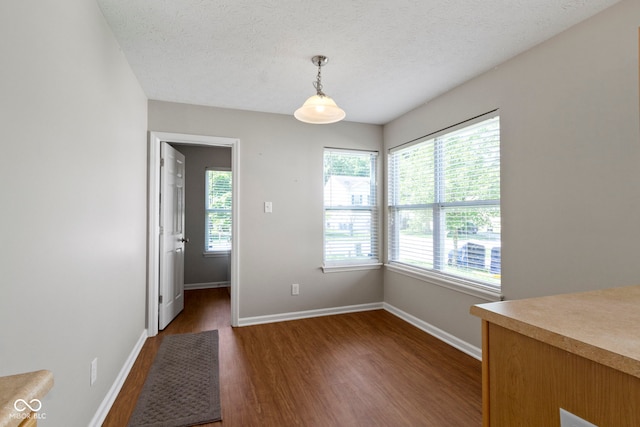 11426 High Grass Dr, Indianapolis, IN 46235 - unfurnished dining area featuring dark wood finished floors and a textured ceiling