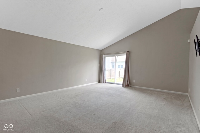 11426 High Grass Dr, Indianapolis, IN 46235 - spare room with lofted ceiling and light colored carpet