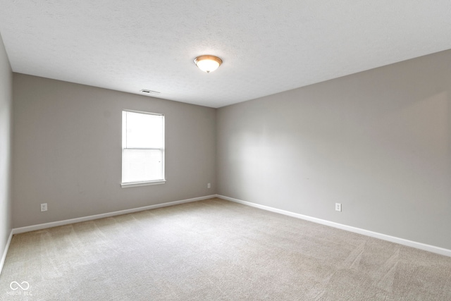11426 High Grass Dr, Indianapolis, IN 46235 - carpeted empty room featuring baseboards and a textured ceiling