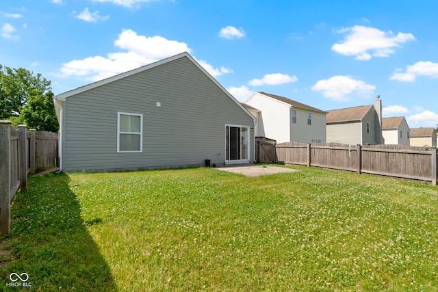 11426 High Grass Dr, Indianapolis, IN 46235 - back of house featuring a patio and a fenced backyard