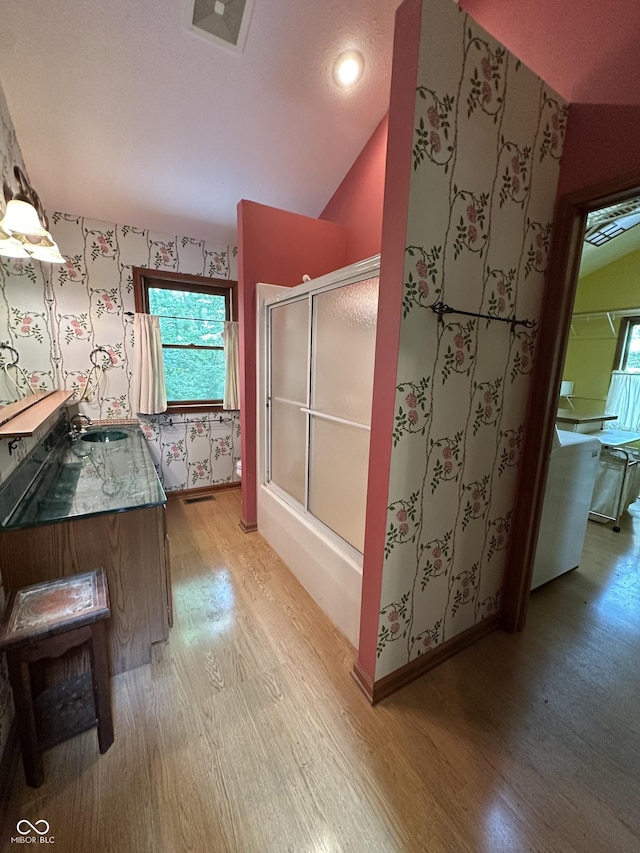 2765 S 1200 E, Zionsville, IN 46077 - bathroom with wood finished floors, a shower with door, lofted ceiling, wallpapered walls, and vanity