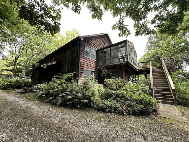 2765 S 1200 E, Zionsville, IN 46077 - view of side of property featuring a sunroom, stairway, and a wooden deck