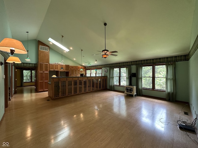 2765 S 1200 E, Zionsville, IN 46077 - unfurnished living room featuring ceiling fan, wood finished floors, and high vaulted ceiling