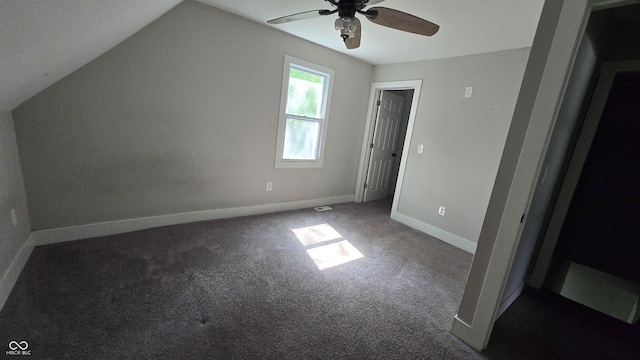 1805 S Denny St, Indianapolis, IN 46203 - unfurnished bedroom with carpet floors, vaulted ceiling, and ceiling fan