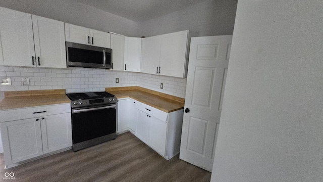 1805 S Denny St, Indianapolis, IN 46203 - kitchen featuring stainless steel appliances, dark wood-style flooring, backsplash, white cabinetry, and light countertops