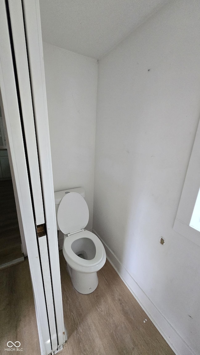 1805 S Denny St, Indianapolis, IN 46203 - bathroom featuring wood finished floors and toilet