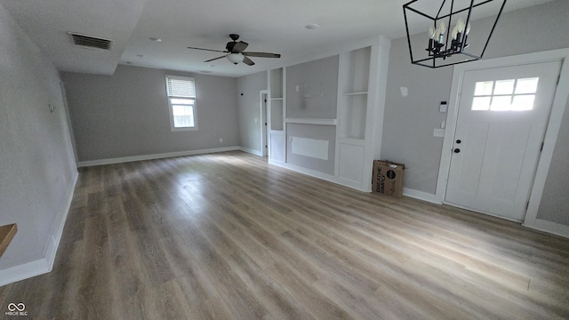 1805 S Denny St, Indianapolis, IN 46203 - foyer with wood finished floors, a ceiling fan, and a chandelier