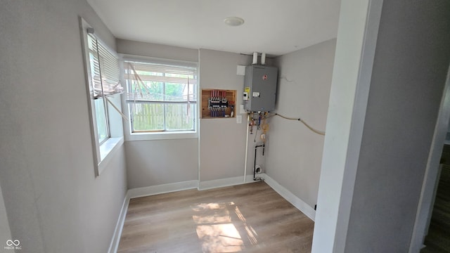 1805 S Denny St, Indianapolis, IN 46203 - laundry room featuring light wood-style floors and water heater