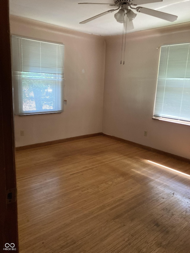 1016 N Mitchner Ave, Indianapolis, IN 46219 - spare room with wood finished floors and ceiling fan