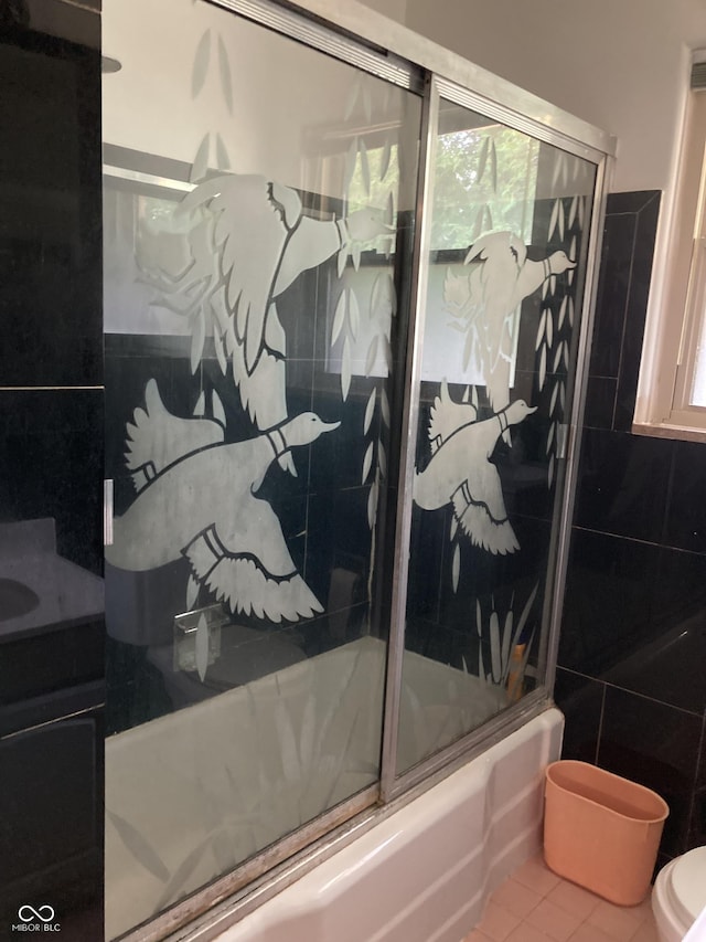 1016 N Mitchner Ave, Indianapolis, IN 46219 - bathroom featuring bath / shower combo with glass door, vanity, and tile patterned flooring