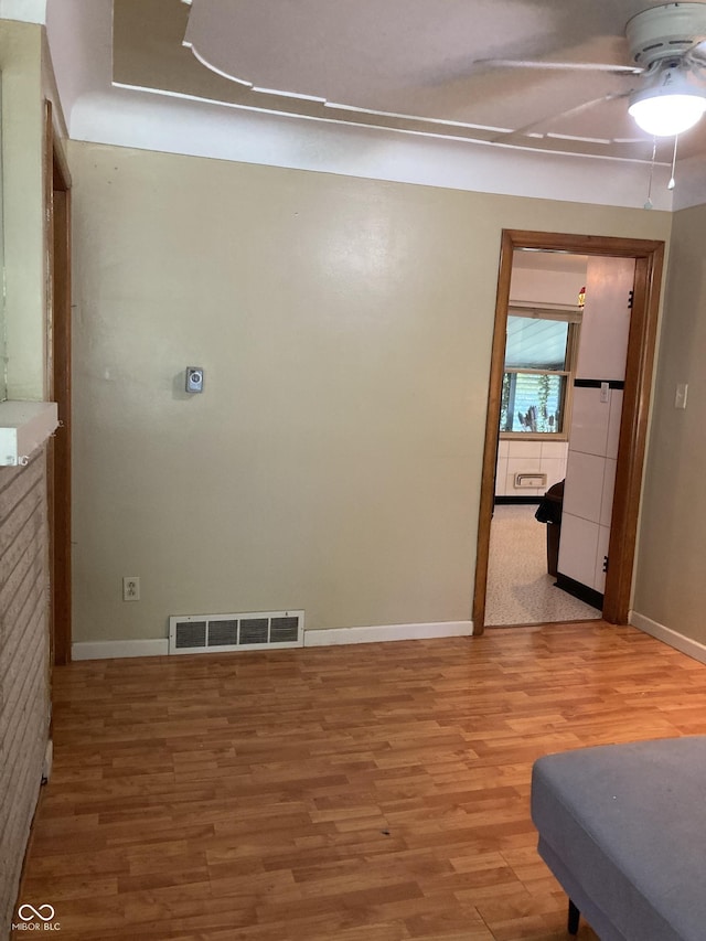 1016 N Mitchner Ave, Indianapolis, IN 46219 - unfurnished room with a ceiling fan and light wood-style flooring