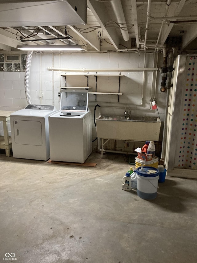1016 N Mitchner Ave, Indianapolis, IN 46219 - unfinished below grade area featuring washer and clothes dryer and concrete block wall