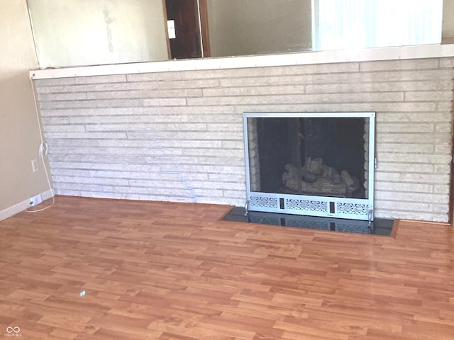 1016 N Mitchner Ave, Indianapolis, IN 46219 - detailed view of wood finished floors and a fireplace