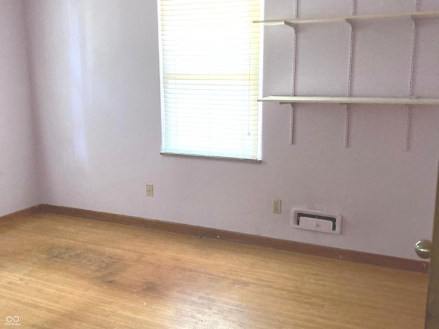 1016 N Mitchner Ave, Indianapolis, IN 46219 - spare room with baseboards and light wood finished floors