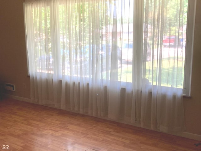 1016 N Mitchner Ave, Indianapolis, IN 46219 - empty room with wood finished floors and baseboards