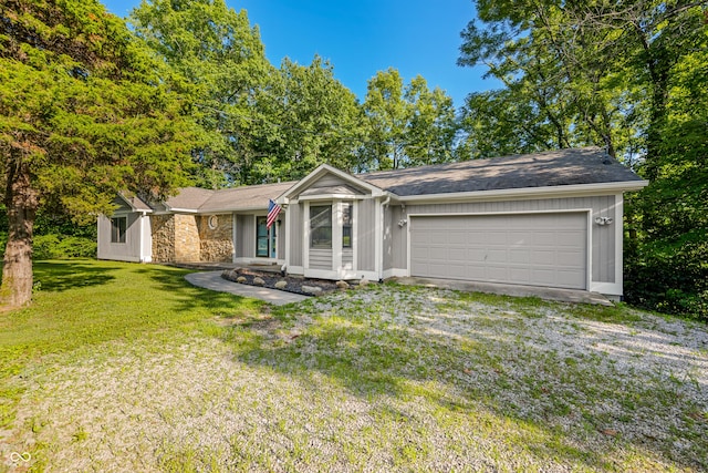173 W Lakeview Dr, Nineveh, IN 46164 - view of front of property featuring an attached garage, a front lawn, driveway, stone siding, and roof with shingles