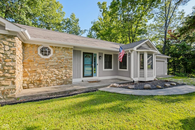 173 W Lakeview Dr, Nineveh, IN 46164 - view of front of home featuring stone siding, a front yard, a porch, and a shingled roof