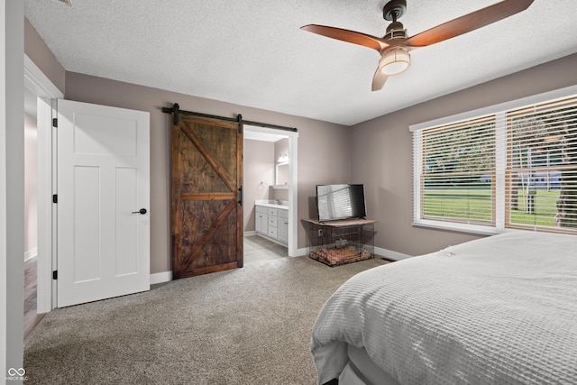 173 W Lakeview Dr, Nineveh, IN 46164 - carpeted bedroom featuring a barn door, ensuite bath, a textured ceiling, and ceiling fan