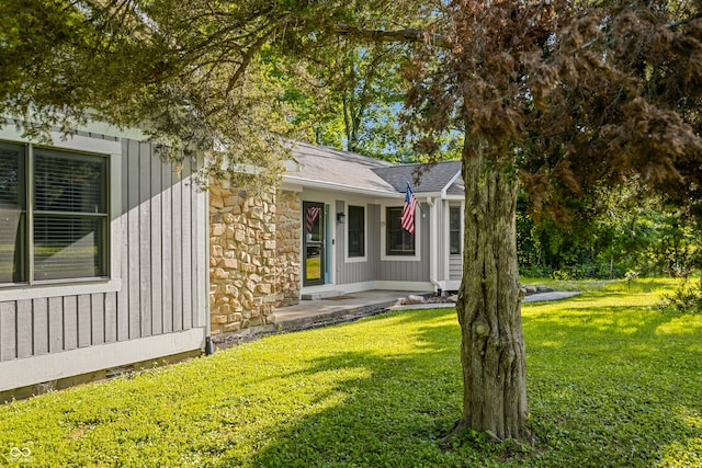 173 W Lakeview Dr, Nineveh, IN 46164 - view of front of home with a front lawn, board and batten siding, and stone siding