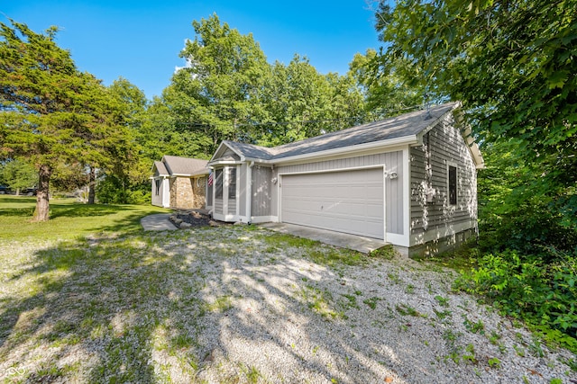173 W Lakeview Dr, Nineveh, IN 46164 - view of side of property with a garage, a lawn, and driveway