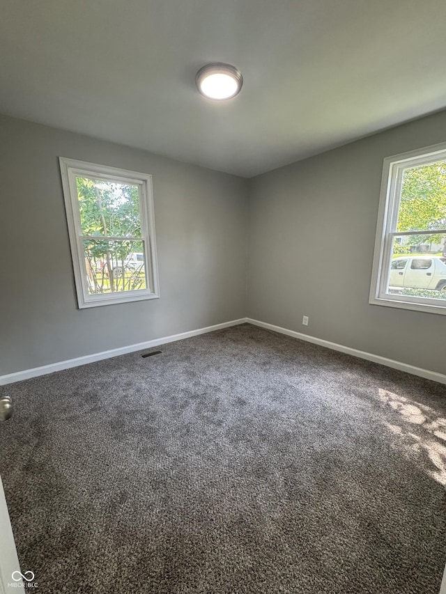 67 N Devon Ave, Indianapolis, IN 46219 - carpeted empty room featuring baseboards