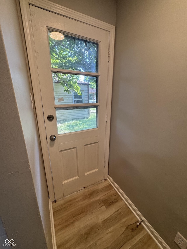 67 N Devon Ave, Indianapolis, IN 46219 - doorway to outside with light wood-type flooring and healthy amount of natural light
