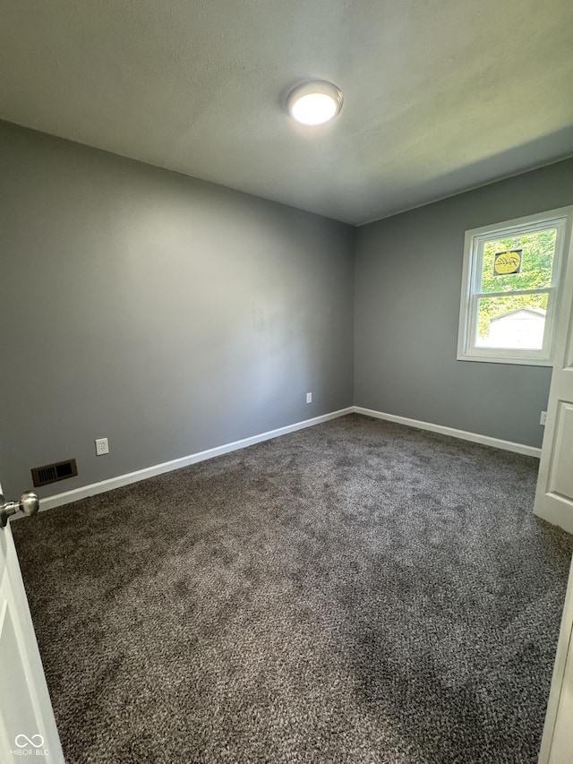 67 N Devon Ave, Indianapolis, IN 46219 - empty room featuring carpet floors and baseboards