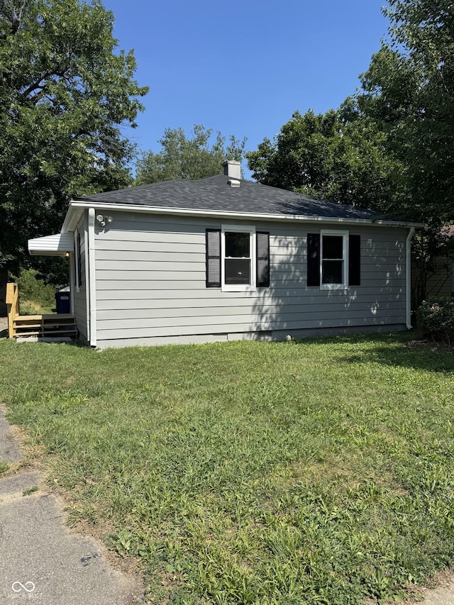 67 N Devon Ave, Indianapolis, IN 46219 - single story home with a front yard and roof with shingles