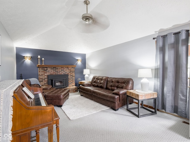 479 Raintree Dr, Danville, IN 46122 - living area featuring carpet, ceiling fan, vaulted ceiling, and a textured ceiling