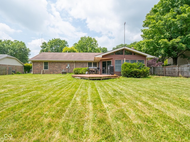 479 Raintree Dr, Danville, IN 46122 - back of house with a wooden deck and brick siding