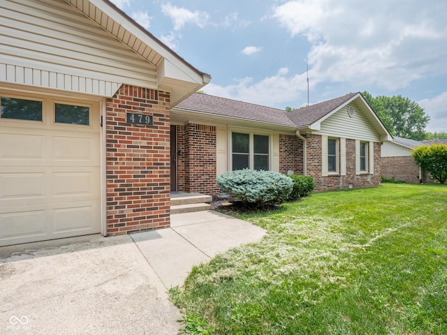 479 Raintree Dr, Danville, IN 46122 - single story home featuring brick siding, an attached garage, a front yard, a shingled roof, and driveway