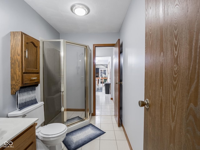 479 Raintree Dr, Danville, IN 46122 - bathroom featuring tile patterned flooring, a shower stall, and vanity