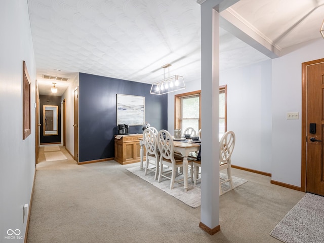 479 Raintree Dr, Danville, IN 46122 - dining area with light colored carpet and a chandelier