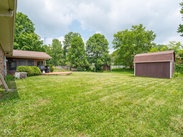 479 Raintree Dr, Danville, IN 46122 - view of yard featuring a storage unit and a sunroom