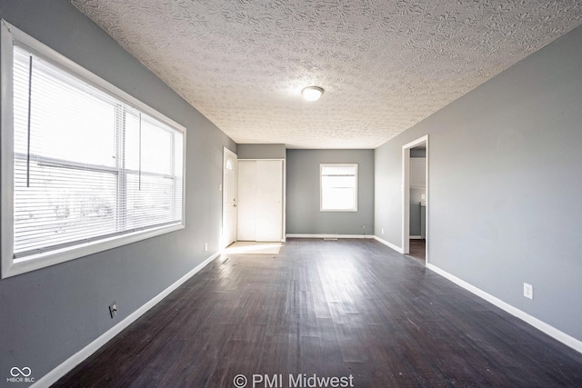 5737 E 22nd St, Indianapolis, IN 46218 - unfurnished room with wood finished floors and a textured ceiling