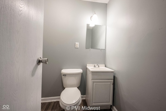 5737 E 22nd St, Indianapolis, IN 46218 - bathroom with vanity and wood finished floors